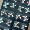 BLISTER DE AROS DE ACERO MARIPOSA ESMALTADA X 12 PARES.