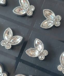 BLISTER DE AROS DE ACERO MARIPOSA CON STRASS X 12 PARES.