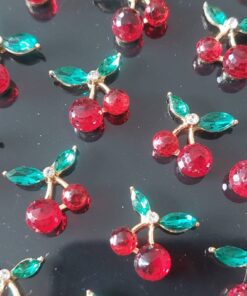 BLISTER DE AROS DE ACERO DORADO CEREZA STRASS COLOR X 12 PARES.
