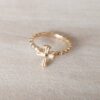 ANILLO DE ACERO DORADO BOLITA SIN FIN CON CRUZ