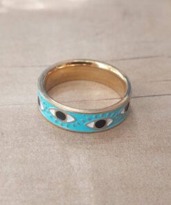 ANILLO CINTA DE ACERO DORADO ESMALTADO CELESTE CON OJITOS