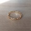 ANILLO DE ACERO DORADO ALIANZA TIPO ESLABÓN.