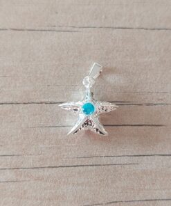 DIJE DE ACERO BLANCO ESTRELLA DE MAR CON STRASS TURQUESA. MEDIDA 15 MM