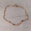 PULSERA DE ACERO DORADO GRUMET CON ESTRELLAS SOLDADAS. LARGO 18,5 CM.