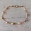 PULSERA DE ACERO DORADO ESPEJITO CON BOLITAS 4 MM. LARGO 18,5 CM