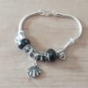 PULSERA DE ACERO BLANCO COLA DE RATÓN 3 MM CON DONAS GAMA NEGRO Y OSTRA. LARGO 19 CM