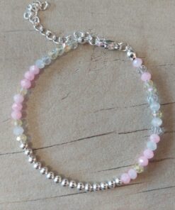 PULSERA DE TANZA CON MOSTACILLAS TONOS ROSA Y BOLITAS CON TERMINAL DE ACERO BLANCO. LARGO 16 CM + 5 EXT