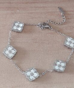 PULSERA DE ACERO ESLABÓN ESPEJITO CON DIJES TRÉBOL NACARADO. LARGO 17,5 + 6 CM EXT.