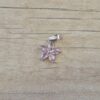 DIJE DE ACERO FLOR STRASS ROSA . MEDIDA 12 MM