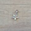 DIJE DE ACERO FLOR STRASS TORNASOL . MEDIDA 12 MM