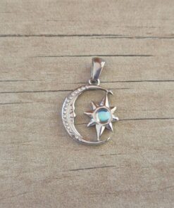 DIJE DE ACERO LUNA Y ESTRELLA CON STRASS Y ACRILICO CELESTE. TAMAÑO 17 MM