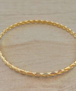 PULSERA DE ACERO DORADA ESCLAVA ENTRELAZADA.