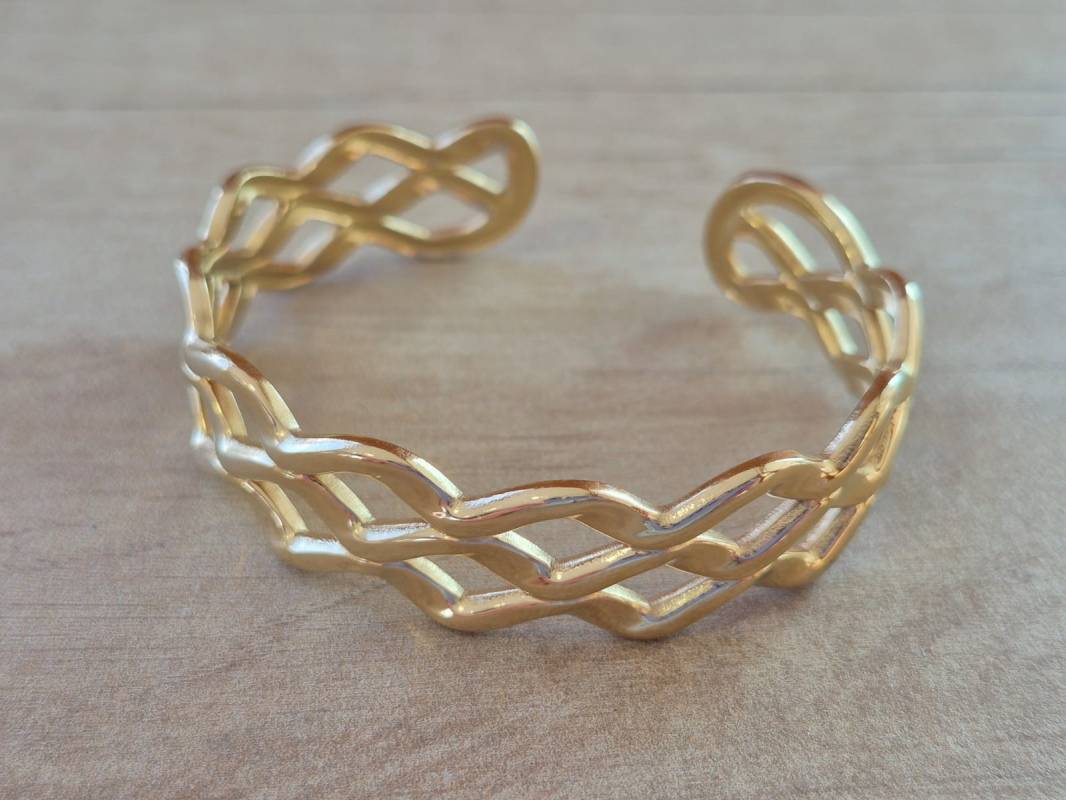 PULSERA DE ACERO DORADO ESCLAVA ABIERTA TRABAJADA