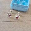 ABRIDOR PLATA FLOR CON STRASS MORADO