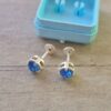 ABRIDOR PLATA CUBIK REDONDO ENGARZADO CELESTE 6 MM