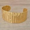 PULSERA DE ACERO DORADO ESCLAVA ABIERTA TRABAJADA