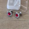ABRIDOR DE ACERO REDONDO CON BORDE GRABADO Y STRASS ROJO
