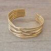 PULSERA DE ACERO DORADO ESCLAVA ABIERTA TRABAJADA