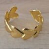 PULSERA DE ACERO DORADO ESCLAVA ABIERTA TRABAJADA