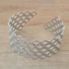 PULSERA DE ACERO ESCLAVA ABIERTA TRABAJADA