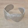 PULSERA DE ACERO ESCLAVA ABIERTA TRABAJADA