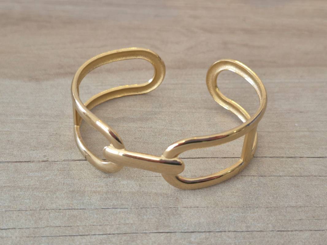 PULSERA DE ACERO DORADO ESCLAVA ABIERTA TRABAJADA