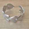 PULSERA DE ACERO ESCLAVA ABIERTA TRABAJADA