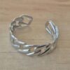 PULSERA DE ACERO ESCLAVA ABIERTA TRABAJADA