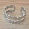 PULSERA DE ACERO ESCLAVA ABIERTA TRABAJADA