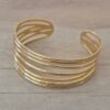 PULSERA DE ACERO DORADO ESCLAVA ABIERTA TRABAJADA