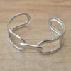 PULSERA DE ACERO ESCLAVA ABIERTA TRABAJADA