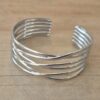 PULSERA DE ACERO ESCLAVA ABIERTA TRABAJADA