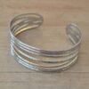 PULSERA DE ACERO ESCLAVA ABIERTA TRABAJADA