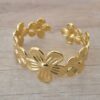 PULSERA DE ACERO DORADO ESCLAVA ABIERTA TRABAJADA