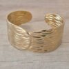 PULSERA DE ACERO DORADO ESCLAVA ABIERTA TRABAJADA