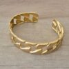 PULSERA DE ACERO DORADO ESCLAVA ABIERTA TRABAJADA