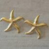 ARO DE ACERO DORADO ESTRELLA DE MAR CON FRU FRU. TAMAÑO 33 MM