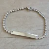 PULSERA DE ACERO TIRA DE STRASS 3.5 MM BLANCO, CON CHAPA 32 X 5 MM PARA GRABAR. LARGO 18 + 5 CM EXT.