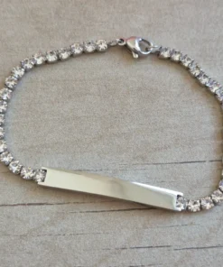PULSERA DE ACERO TIRA DE STRASS 3.5 MM BLANCO, CON CHAPA 32 X 5 MM PARA GRABAR. LARGO 18 + 5 CM EXT.
