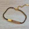PULSERA DE ACERO DORADO TIRA DE STRASS 3.5 MM NEGRO, CON CHAPA 32 X 5 MM PARA GRABAR. LARGO 18 + 5 CM EXT.