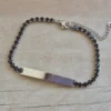 PULSERA DE ACERO TIRA DE STRASS 3.5 MM NEGRO, CON CHAPA 32 X 5 MM PARA GRABAR. LARGO 18 + 5 CM EXT.